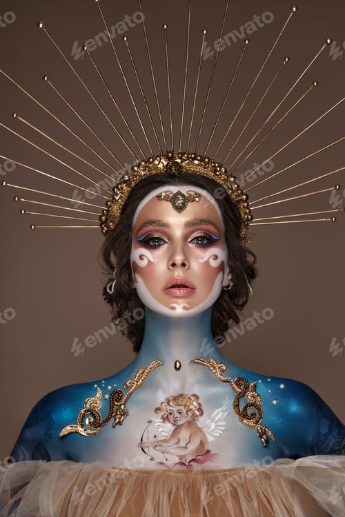 Preview: Portrait of a girl with gold and blue creative art make-up.