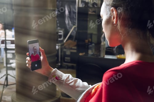 Preview: Pretty girl making selfie during preparation to the show