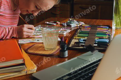 Preview: female artist painter painting a picture of a easter bunny