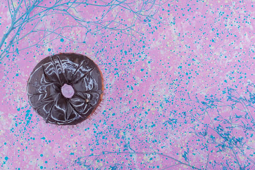 Preview: Chocolate doughnut isolated on texture background