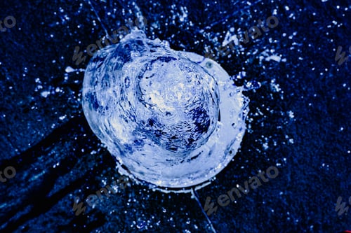 Preview: Water jet going up towards the camera, blue tones, background for hydrological concept.