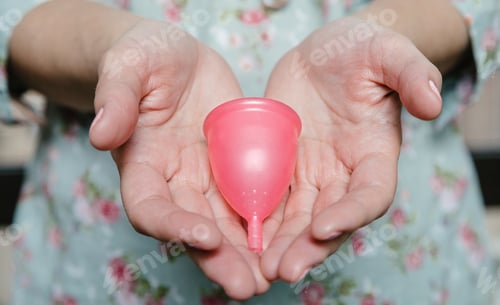Preview: Close up of woman hands showing menstrual cup