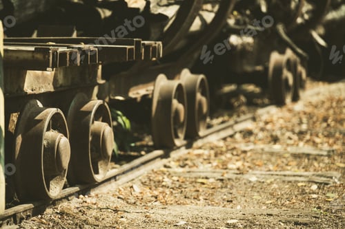 Preview: Iron wheels of an old train riding on the rails