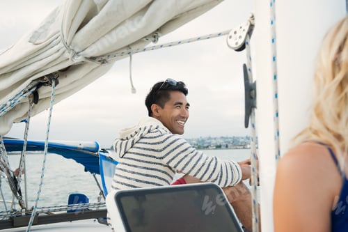 Preview: Young man on sailing boat, laughing