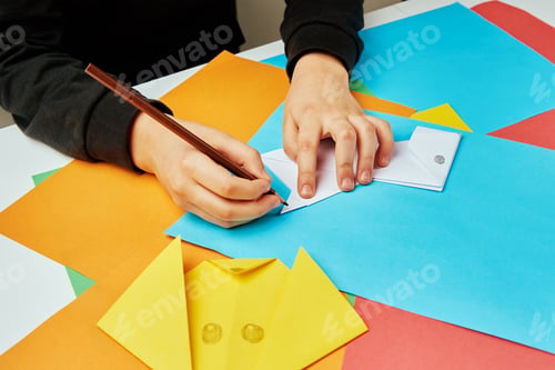 Preview: Boy making paper dog origami