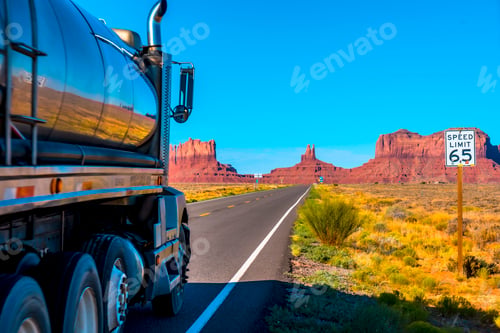 Preview: A truck by the road with its yellow lines of Monument Valley, Utah