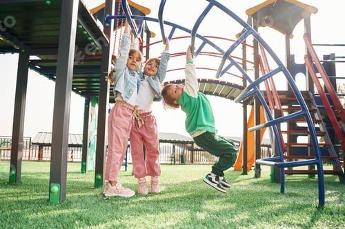 Preview: Beautiful sunlight. Kids are having fun on the playground