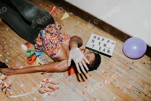 Preview: Happy woman on the floor at a party
