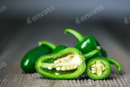 Preview: Macro shot of half green mexican jalapeno hot pepper