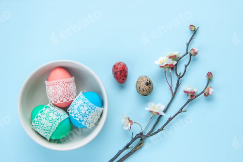 Preview: top view colored painted eggs inside plate on blue surface holiday spring concept ethnic ornate