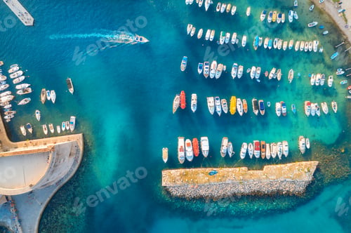 Preview: Aerial view of colorful boats and yachts in port in blue sea