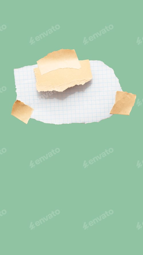 Preview: Torn piece of school notebook in a grid and brown piece of paper with beige tape on green background