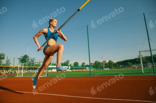 Preview: Female high jumper training at the stadium in sunny day