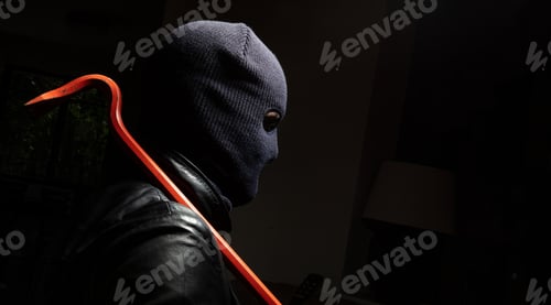Preview: Hooligan in balaclava holding a crowbar, black background