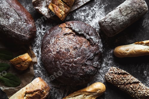 Preview: Different types of bread on black background