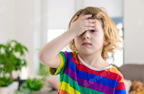 Preview: The child has a headache. Selective focus.