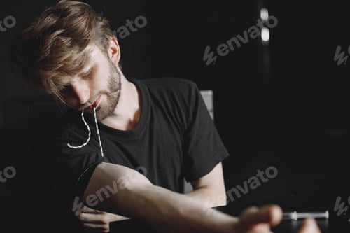 Preview: Drug addict injecting heroin into arm