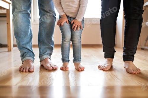 Preview: Beautiful young family. Bare feet of mother, father and daughter