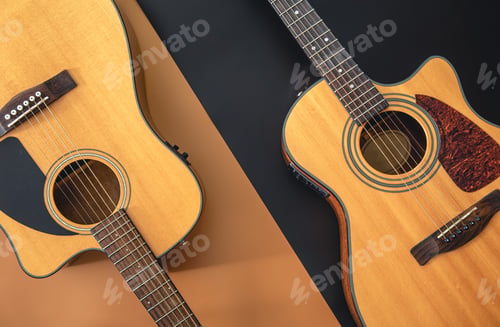 Preview: Two acoustic guitars on a colored background, flat lay.