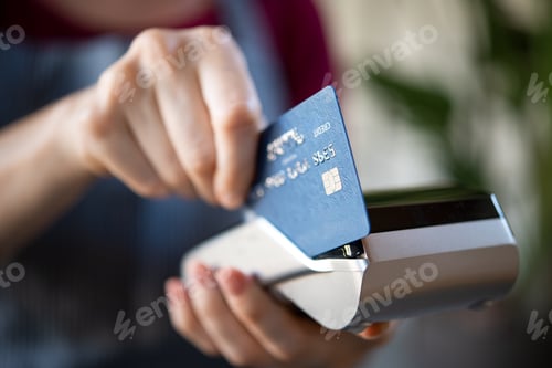 Preview: Waitress swiping credit card on pos