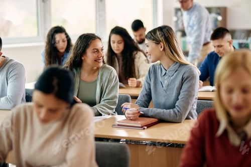 Preview: Happy female students talking during a class at the university.