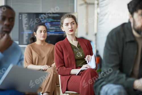 Preview: Focused Young Woman at Business Seminar