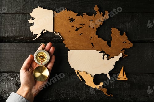 Preview: Columbus Day. Vintage compass with wooden model of America