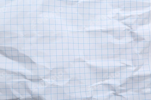Preview: Crumpled checkered notebook sheet as background, top view