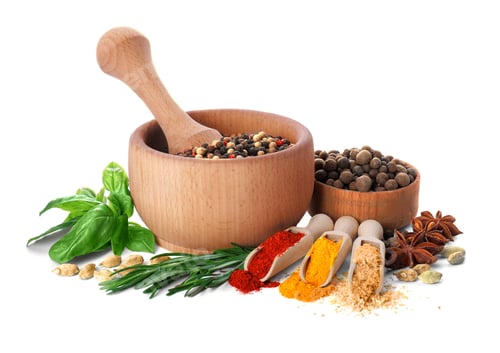 Preview: Mortar with pestle and different spices on white background