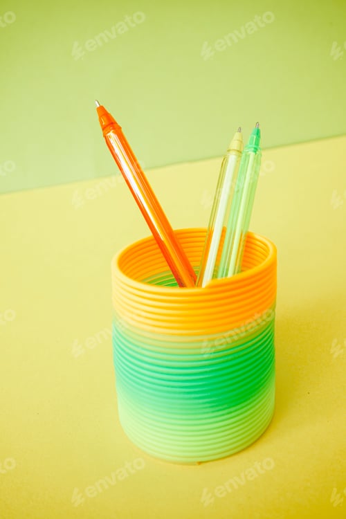 Preview: Colorful pens inside a colorful slinky toy