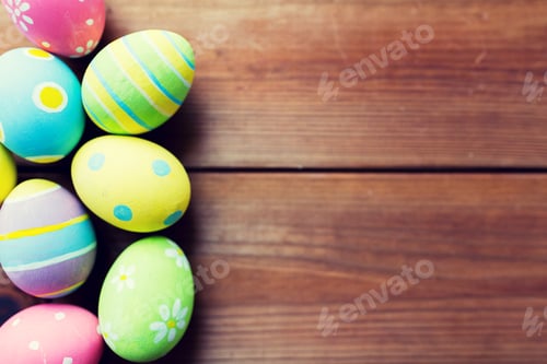 Preview: close up of colored easter eggs on wooden surface