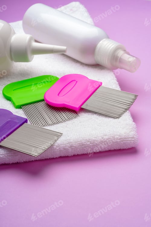 Preview: Anti lice combs and towel on pink background