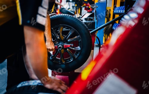 Preview: Technical man repairs, maintenance and set the wheel center.