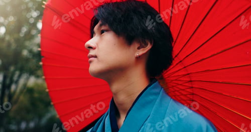 Preview: Kimono, umbrella and reflection with Japanese man in city for traditional ceremony, thinking and cu