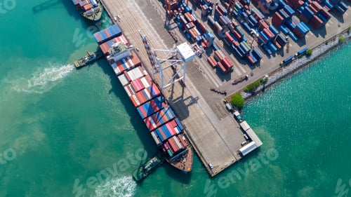 Preview: Crane loading box container to cargo ship at commercial dock port. Shipyard Cargo Container