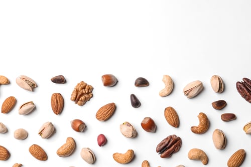 Preview: Composition with organic mixed nuts on white background, top view. Space for text