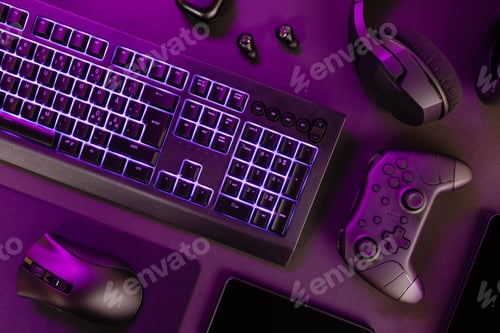 Preview: Purple lit keyboard amidst wireless devices