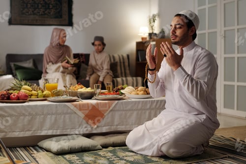 Preview: Young Muslim Man Praying At Home On Eid Al-Fitr