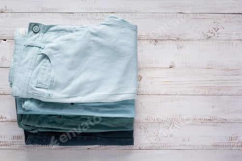 Preview: Denim jeans on old wooden background texture table surface