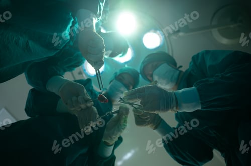Preview: Surgical Team Performing Operation Under Bright Lights