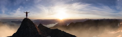 Preview: Adventurous Adult Woman Hiker on top of Rocky Mountain