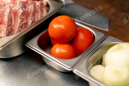 Preview: close up In a professional kitchen in rib house vegetables for cooking ribs lie on an iron table