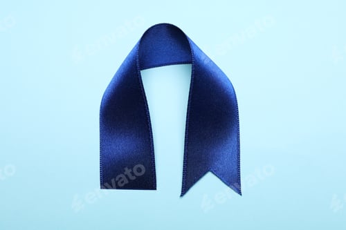 Preview: Blue satin ribbon on blue background, close up