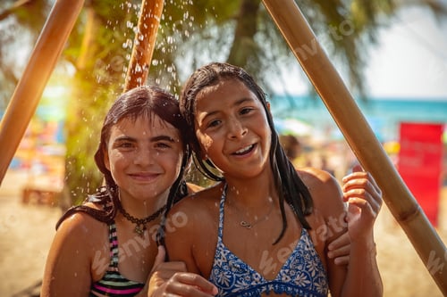 Preview: Two happy girls on the beach