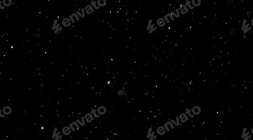 Preview: Falling snow on a black background. Selective focus.