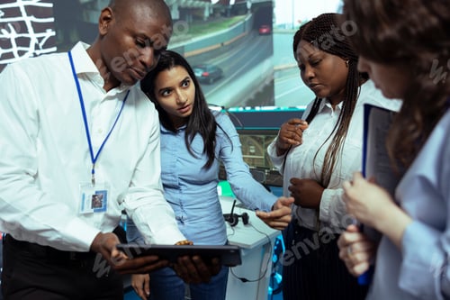 Preview: Team of diverse employees analyzing order logistics on awb papers