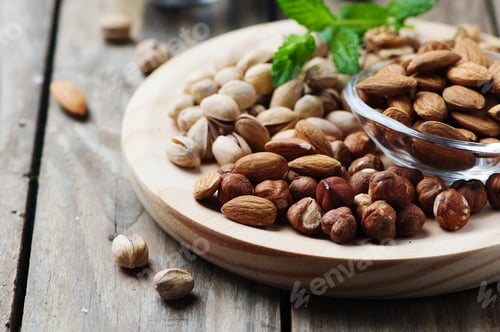 Preview: Mix of nuts on the wooden table