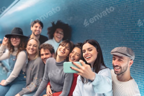 Preview: Group young friends taking selfie with mobile smartphone in subway underground metropolitan