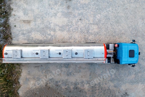 Preview: Aerial top view of big metal fuel tanker truck shipping fuel.