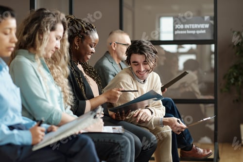 Preview: People discussing business contract at office